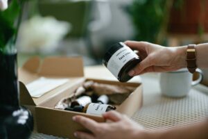 consumer_beauty_products_box_opening_reveal_face_cream_hands_with_watch