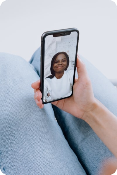 Hand holding device with telehealth video call on screen
