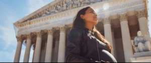Pregnant woman standing in front of the scotus