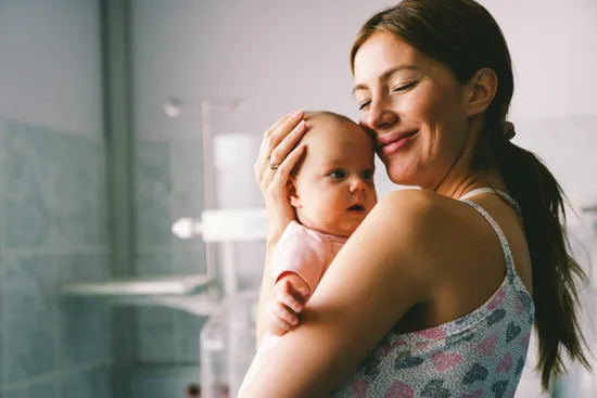 Mom hugging baby