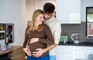 a loving father with pregnant wife