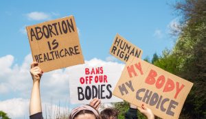 Protesters,Holding,Signs,Abortion,Is,Healthcare,,My,Body,My,Choice,